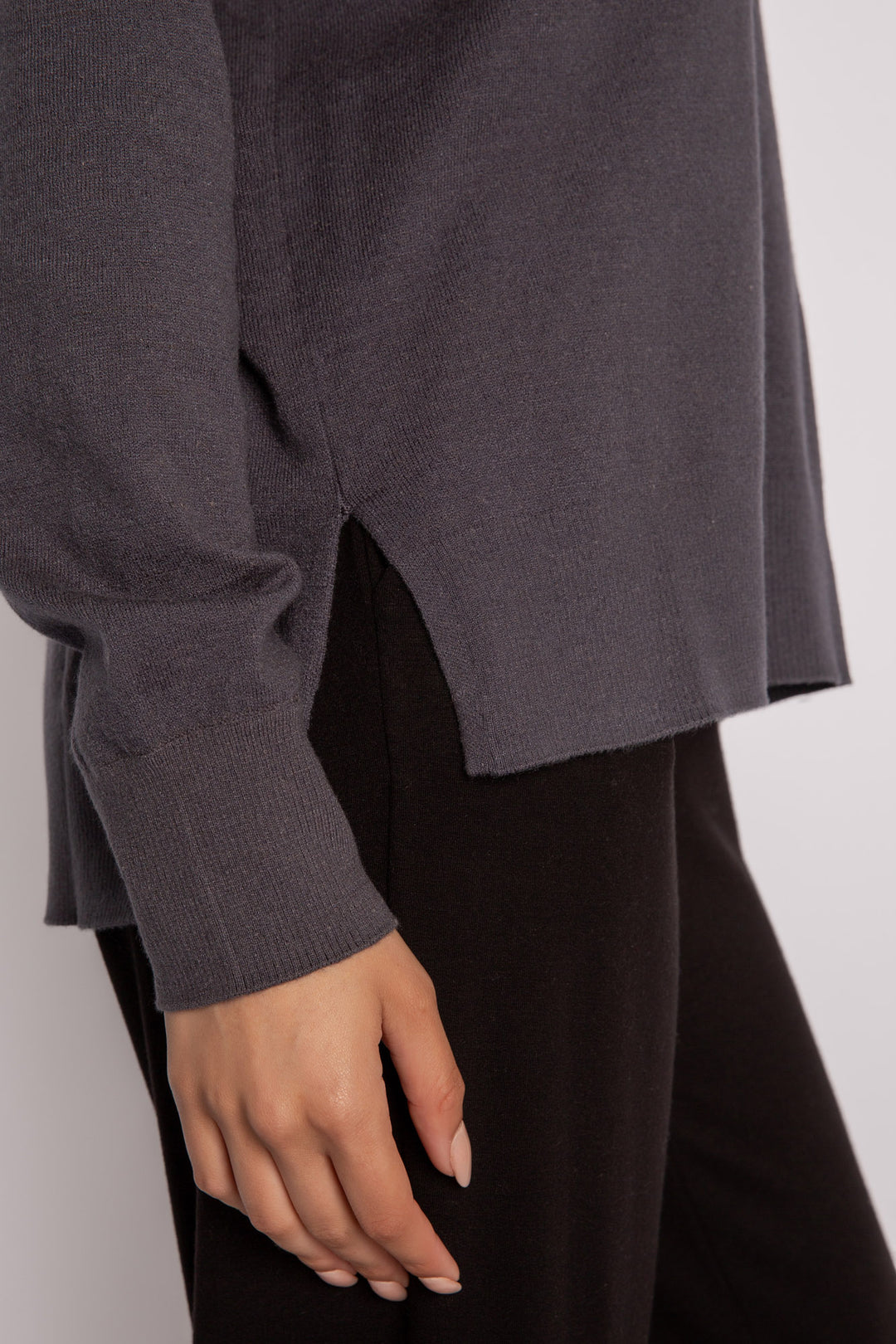 Sweater-knit V-neck sweater in charcoal with open high-low hem. (7231885803620)