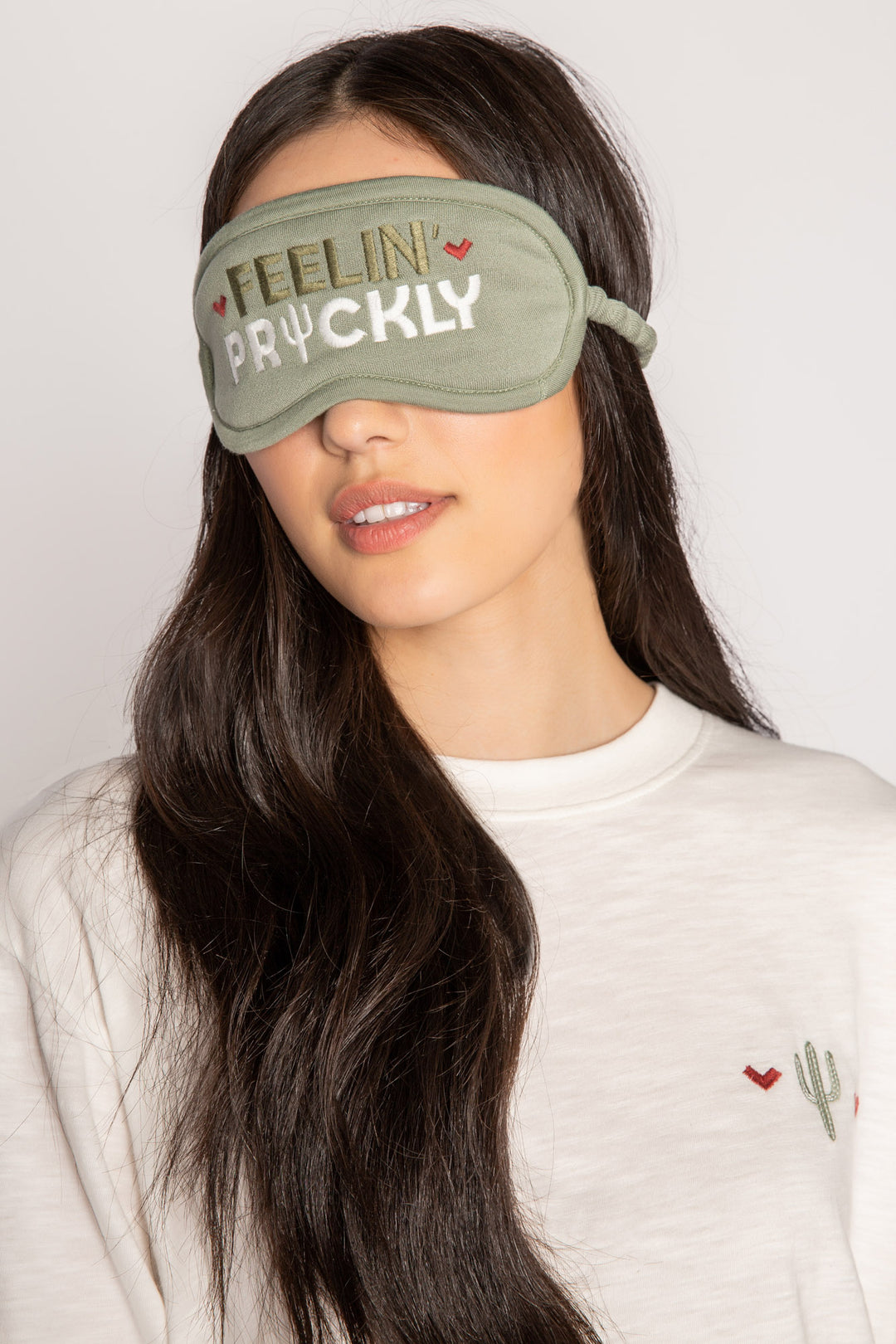 Olive cozy sleep mask with 'Feelin Prickly' embroidery on front. Gathered elastic band for fit. (7231888097380)