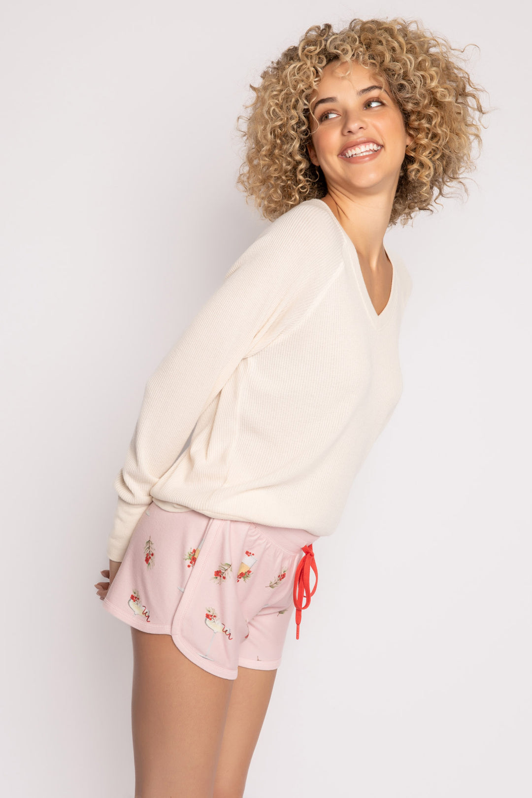 Light pink pajama short with mistletoe & cocktail print. Contrast red stitching & red tie waist. (7257677135972)
