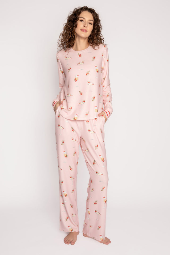 Light pink pj set with mistletoe & cocktail print. Top & straight-leg pant with pockets. Contrast red tie waist. (7257677201508)