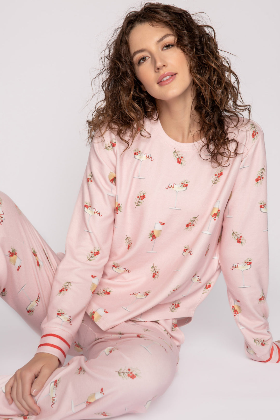 Light pink pj set with mistletoe & cocktail print. Top & straight-leg pant with pockets. Contrast red tie waist. (7257677201508)