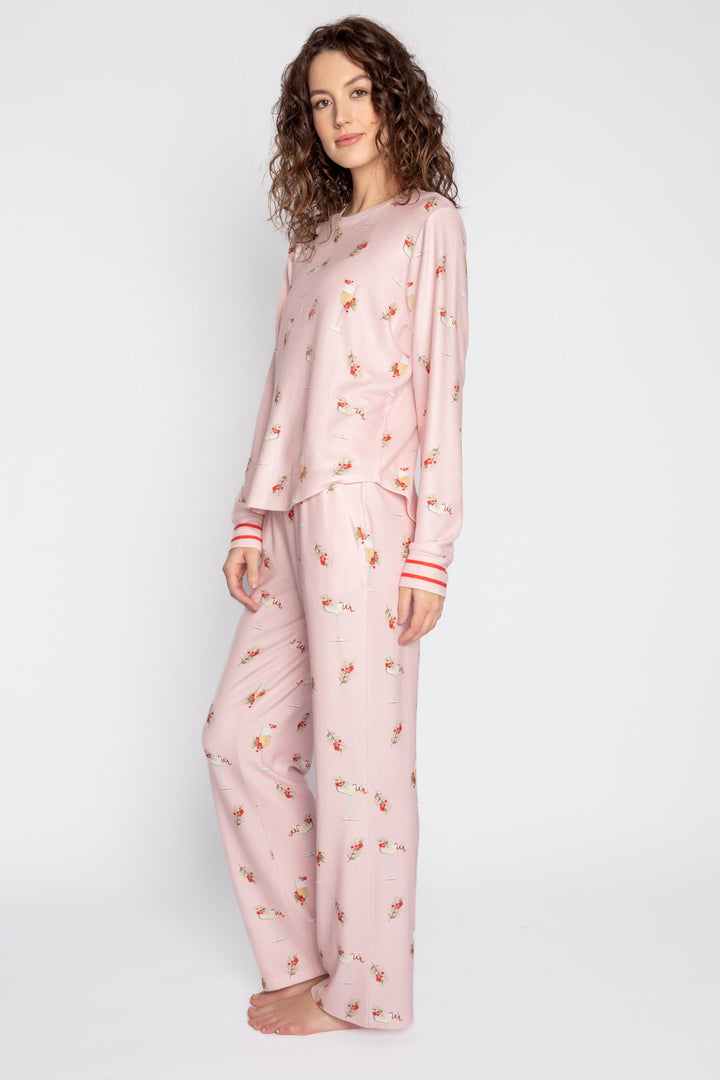 Light pink pj set with mistletoe & cocktail print. Top & straight-leg pant with pockets. Contrast red tie waist. (7257677201508)