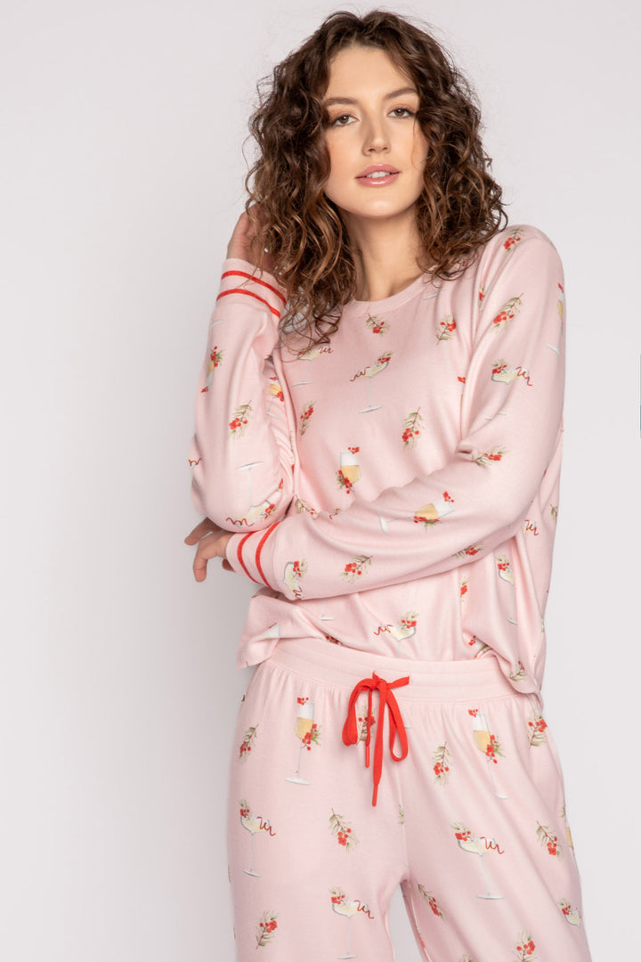 Light pink pj set with mistletoe & cocktail print. Top & straight-leg pant with pockets. Contrast red tie waist. (7257677201508)