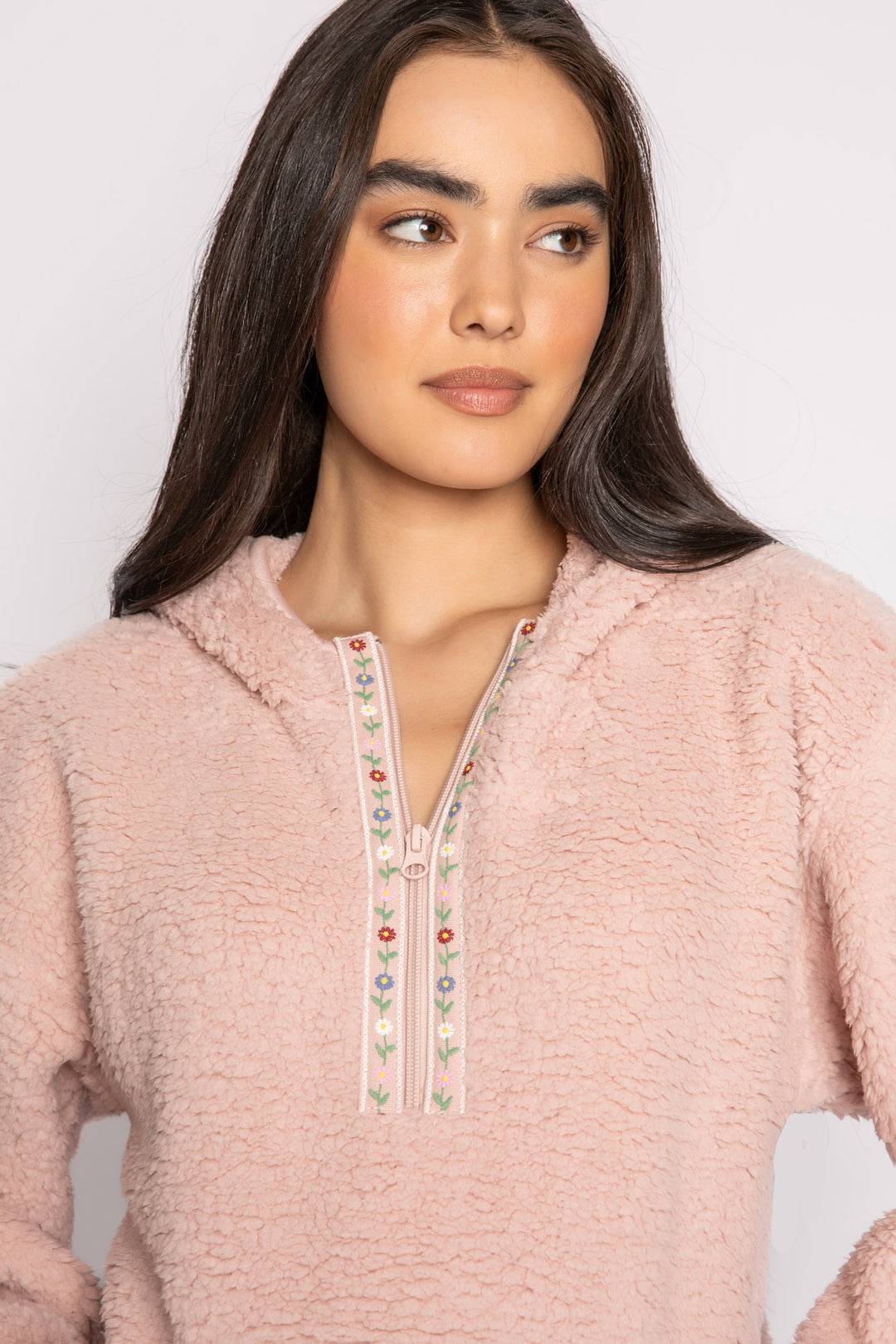 Pink half-zip pullover in faux shearling fur with embroidered taping. Front pocket & banded cuffs. (7257677267044)
