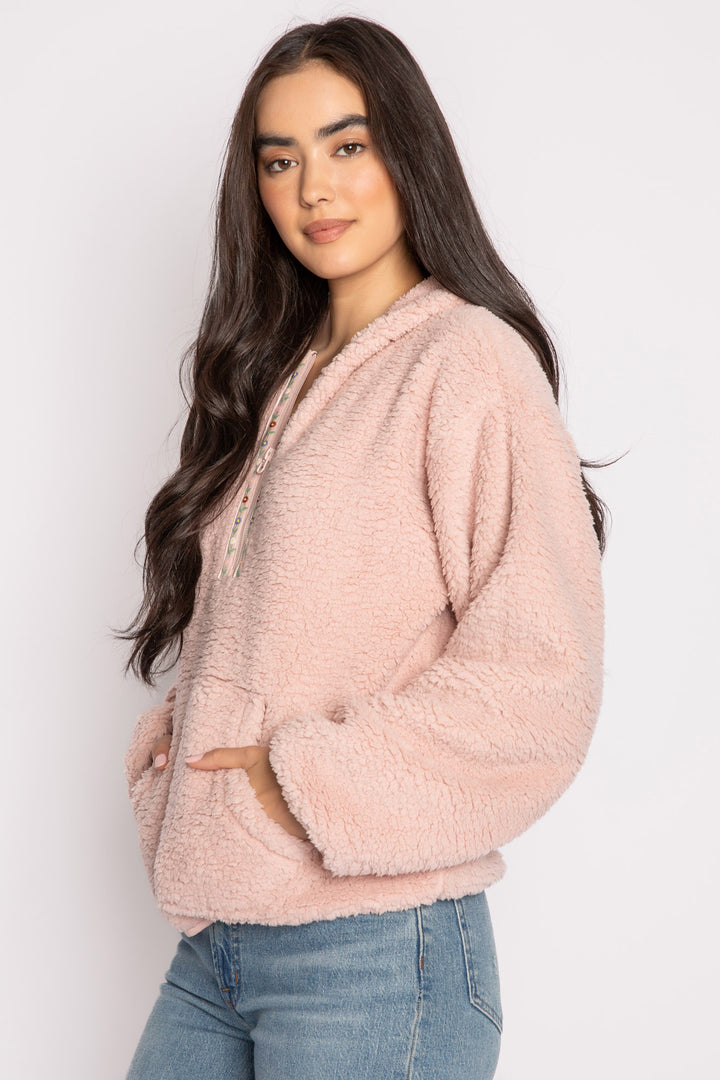 Pink half-zip pullover in faux shearling fur with embroidered taping. Front pocket & banded cuffs. (7257677267044)