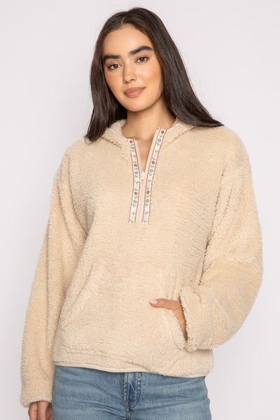 Ivory half-zip pullover in faux shearling fur with embroidered taping. Front pocket & banded cuffs. (7257677299812)