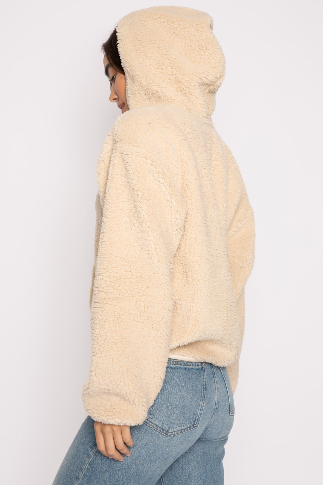 Ivory half-zip pullover in faux shearling fur with embroidered taping. Front pocket & banded cuffs. (7257677299812)
