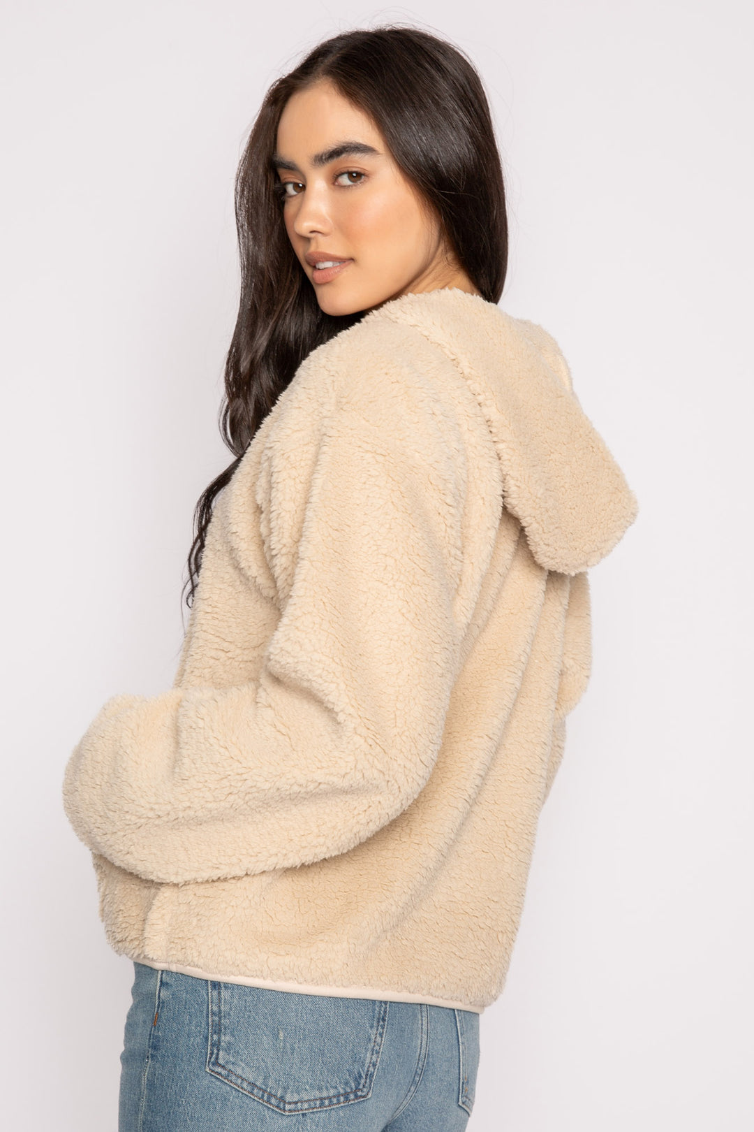 Ivory half-zip pullover in faux shearling fur with embroidered taping. Front pocket & banded cuffs. (7257677299812)