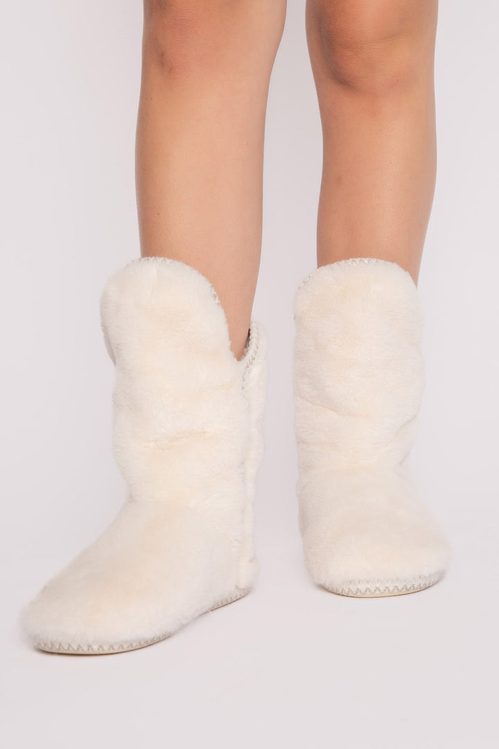 Ivory faux fur slouchy bootie with side taping. Molded sole for indoor-outdoor wear. (7257677463652)
