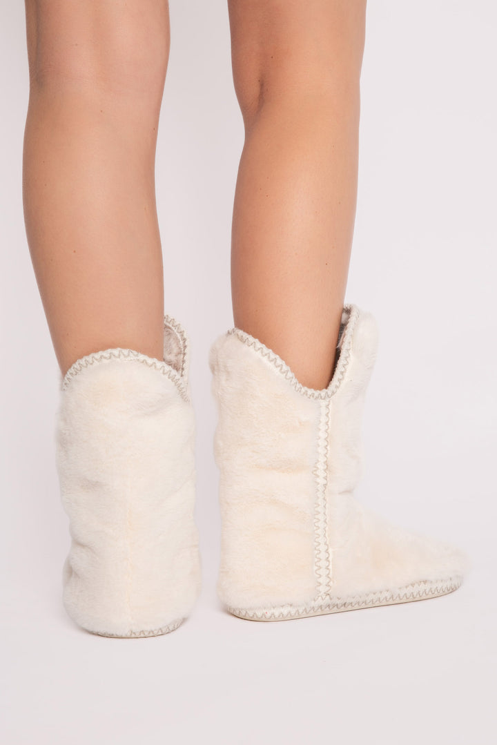 Ivory faux fur slouchy bootie with side taping. Molded sole for indoor-outdoor wear. (7257677463652)