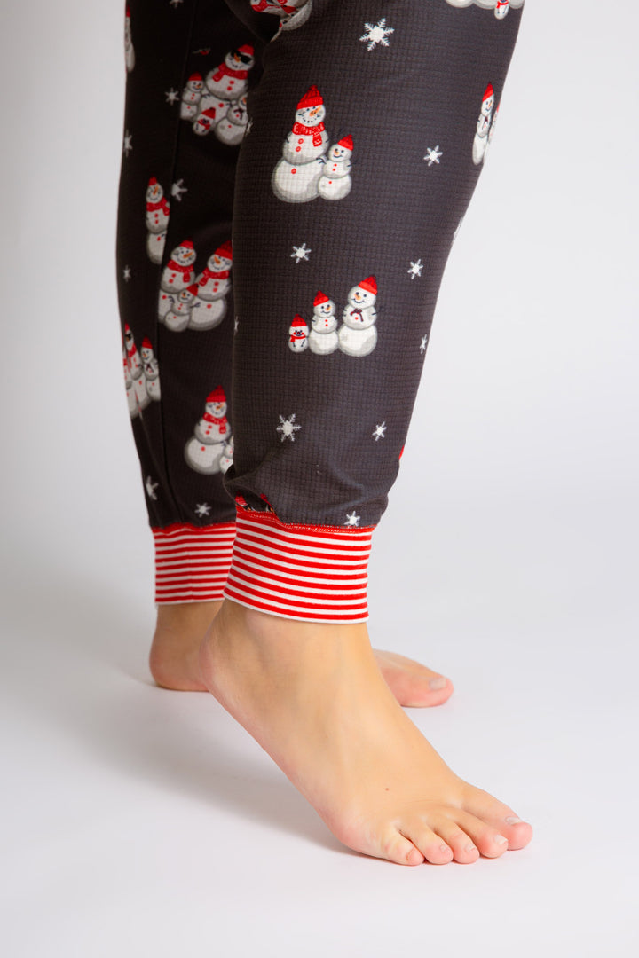 Festive pj set in grey thermal velour top & jammie pant with snowman print. Red & white striped cuffs. (7257677922404)