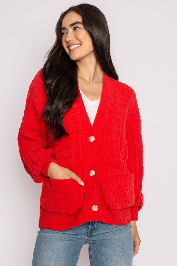 Cardigan sweater in red chenille knit cable pattern. Two lower front pockets & 3-button closure. (7257677987940)