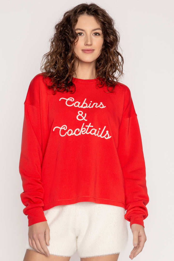 Red fleece pullover top with 'Cabins & Cocktails' script embroidery at chest in ivory. (7257678446692)