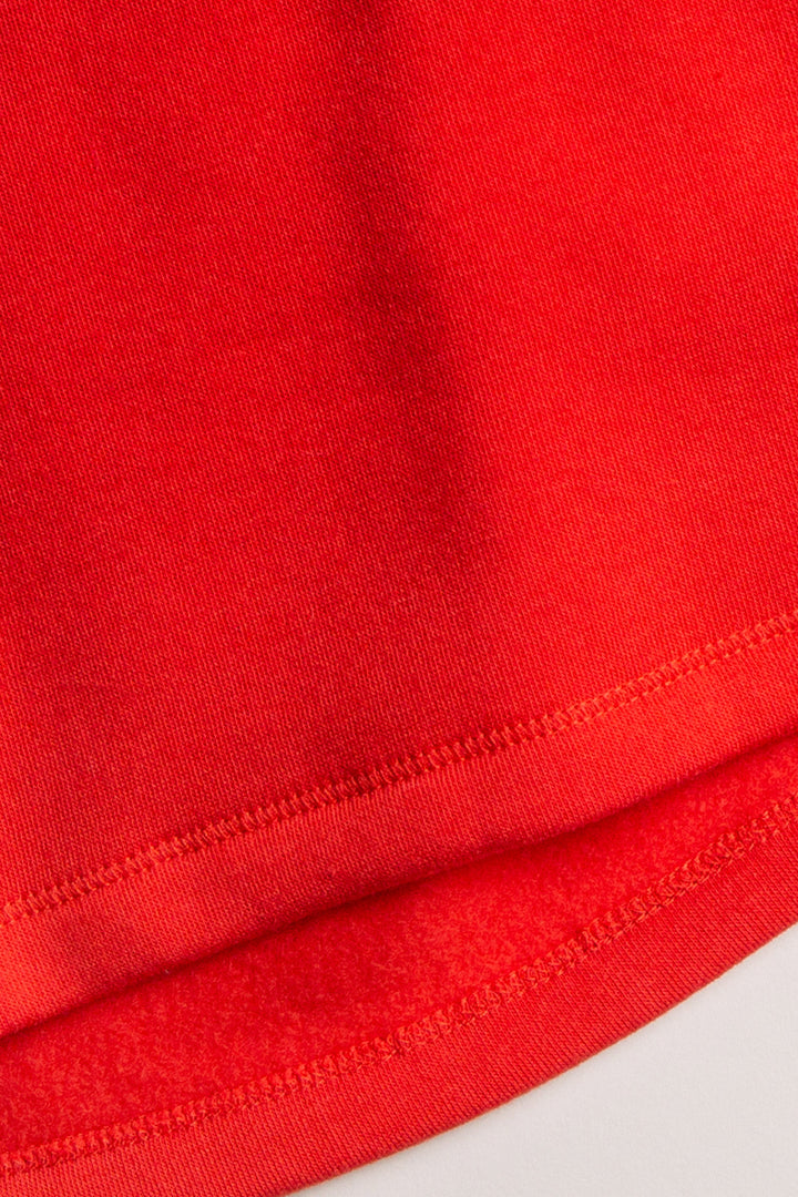 Red fleece pullover top with 'Cabins & Cocktails' script embroidery at chest in ivory. (7257678446692)