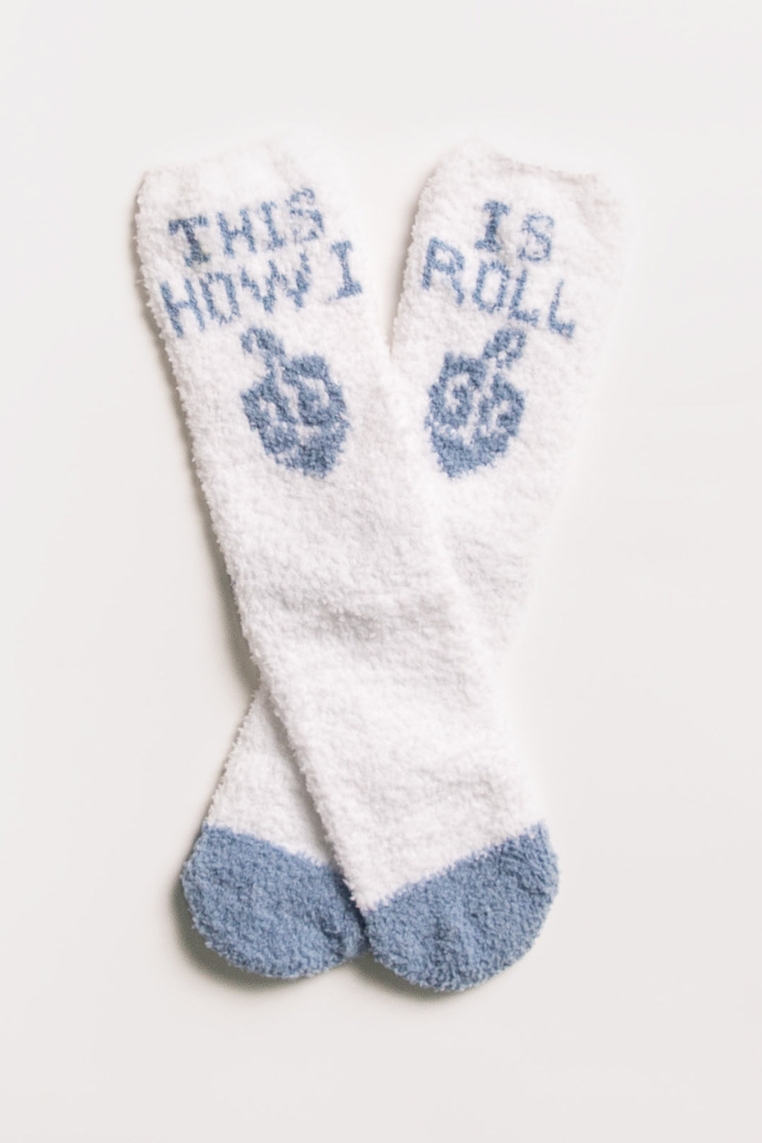 Ivory plush socks with blue 'This is how I roll' dreidel Hanukkah print. Gripper print on soles. (7257678905444)