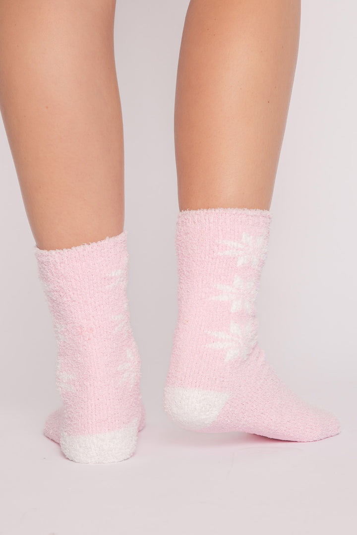 Pink plush sock with ivory snowflakes on sides. Ivory toe contrast. Gripper print on soles for non-skid. (7257679102052)