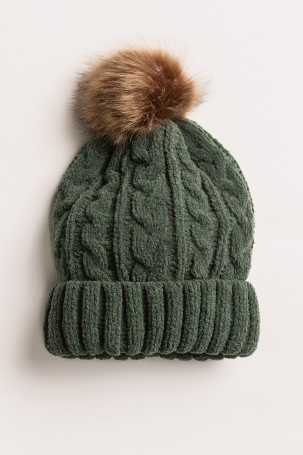 Beanie hat in dark green chenille knit with cable pattern. Tan pom-pom puff at top. (7257679265892)