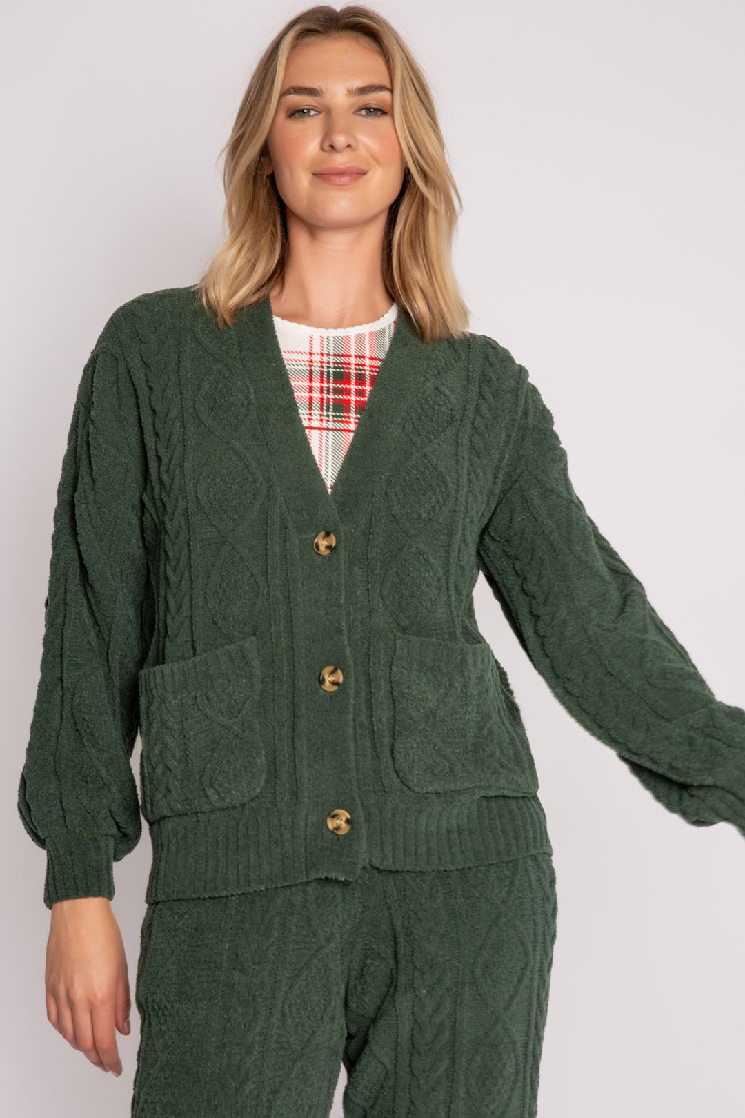 Cardigan sweater in green chenille knit cable pattern. Two lower front pockets & 3-button closure. (7257679298660)