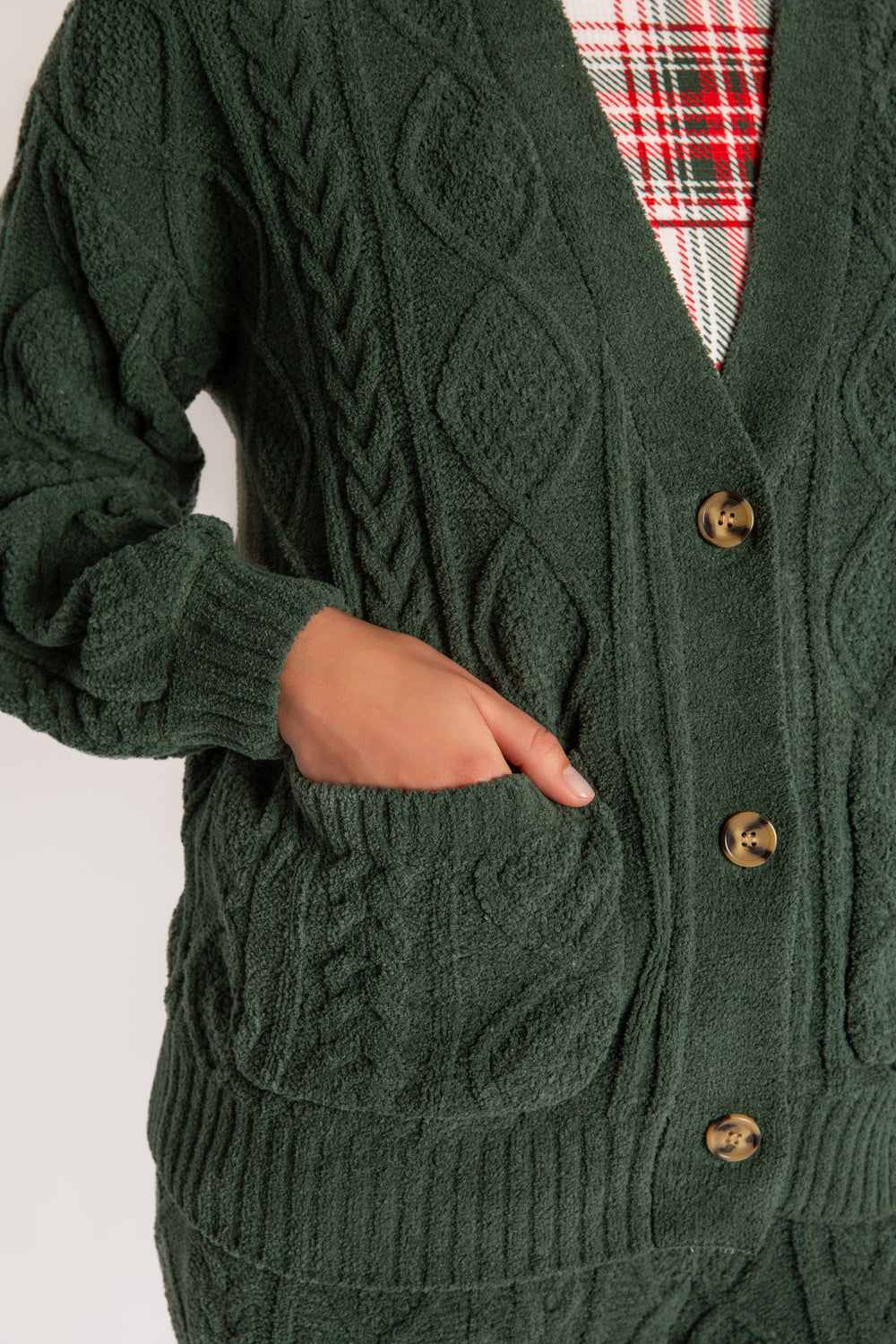 Cardigan sweater in green chenille knit cable pattern. Two lower front pockets & 3-button closure. (7257679298660)