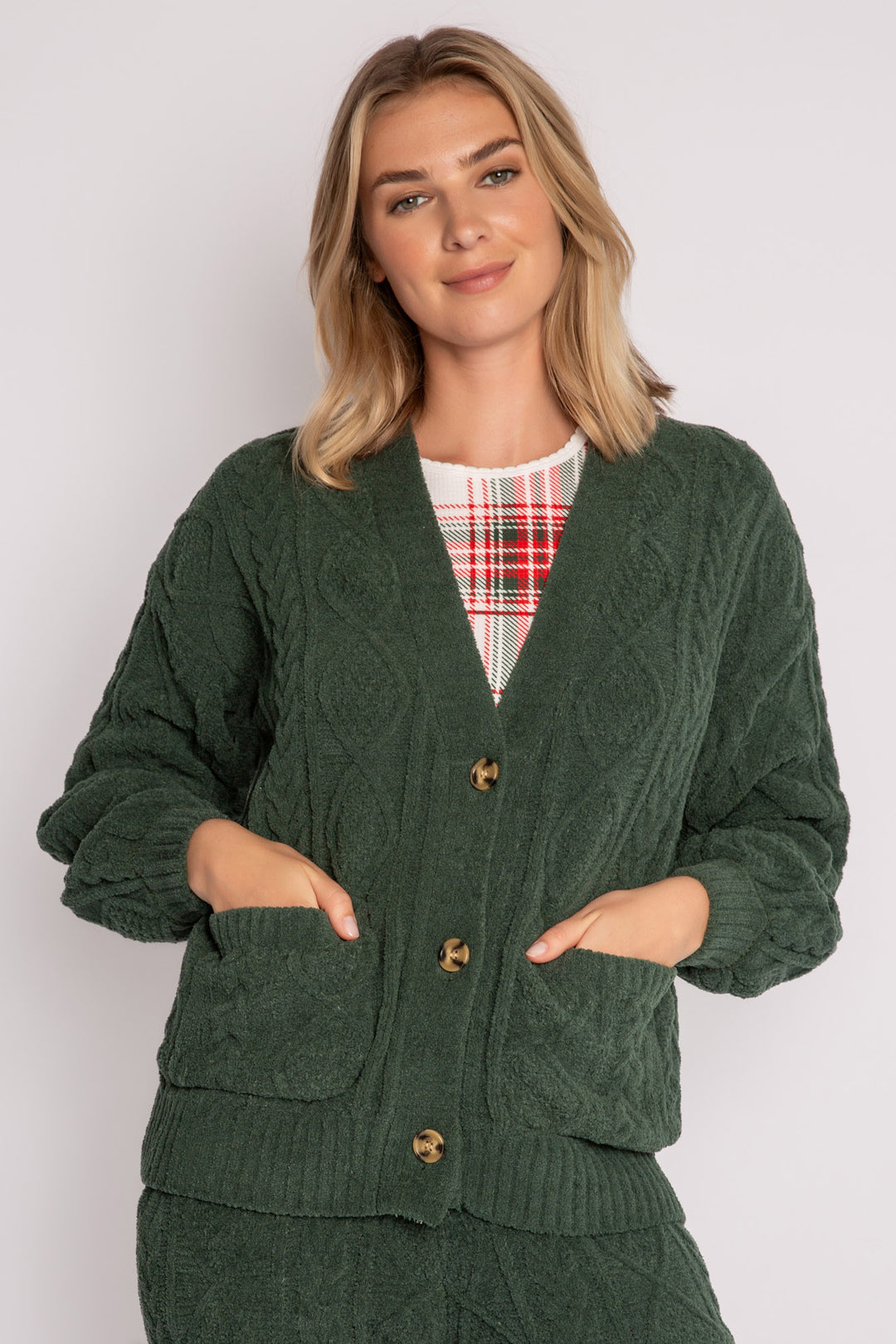 Cardigan sweater in green chenille knit cable pattern. Two lower front pockets & 3-button closure. (7257679298660)