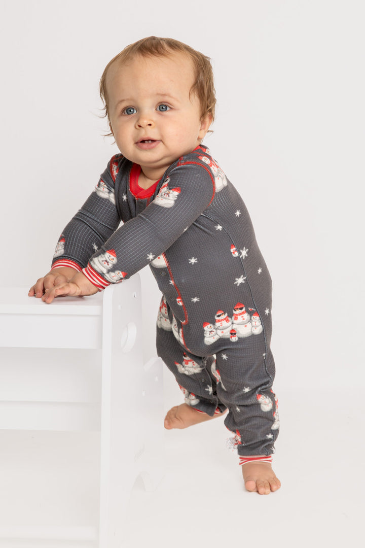 Infant pajama in grey thermal velour with festive snowman print. Red & white striped cuffs. (7257679626340)