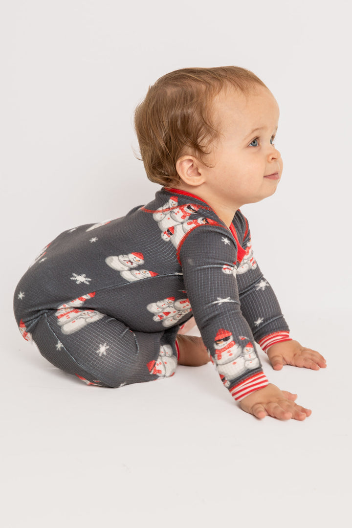 Infant pajama in grey thermal velour with festive snowman print. Red & white striped cuffs. (7257679626340)