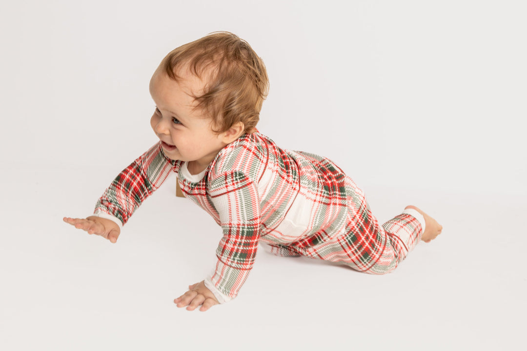 Baby pj romper in gender-neutral ivory-red-green plaid on velour thermal. Covered snaps. (7257679691876)