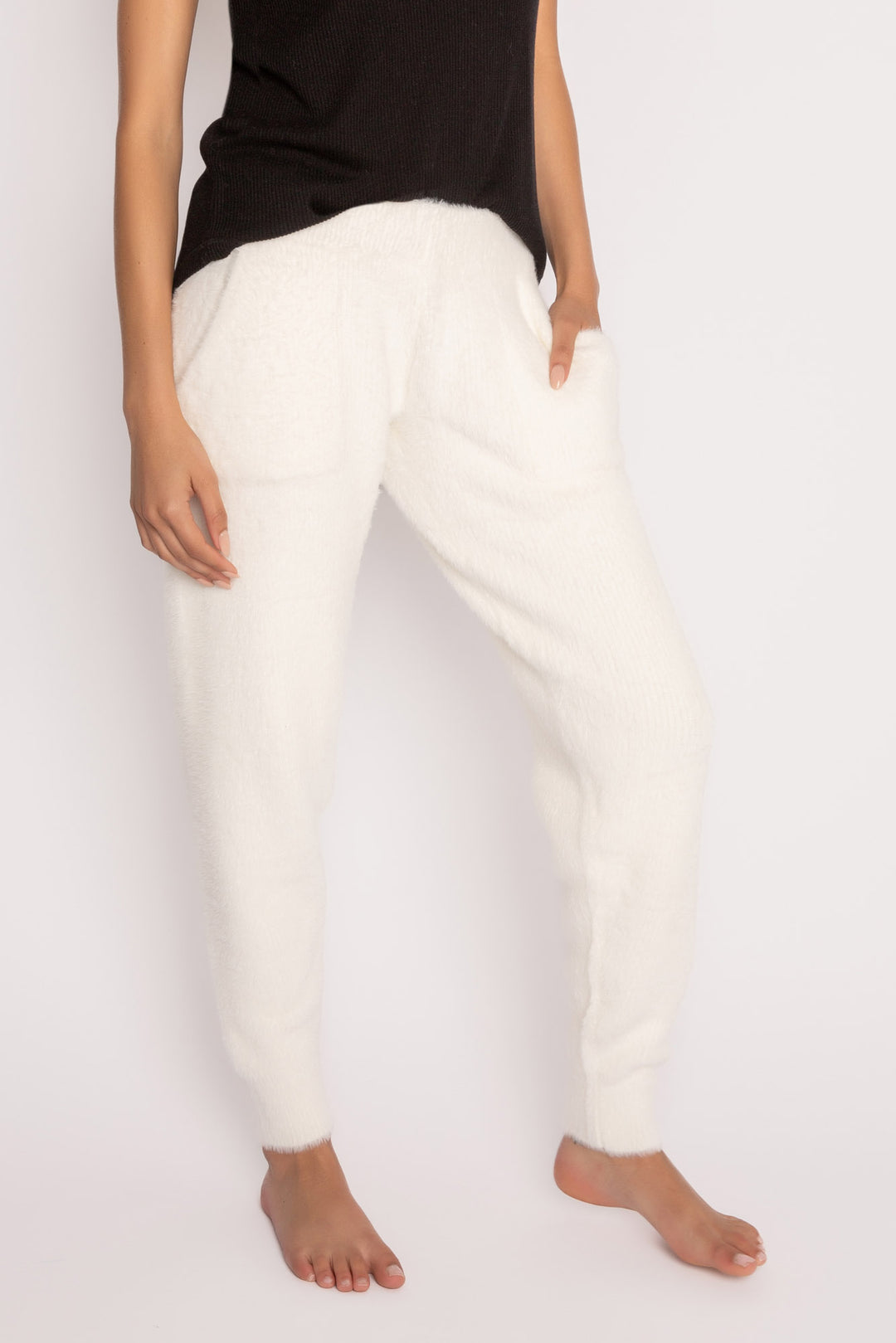 Soft ivory feather knit jogger sweater pant, with relaxed fit. Ribbed cuffs, tie waist & front pockets. (7257680216164)