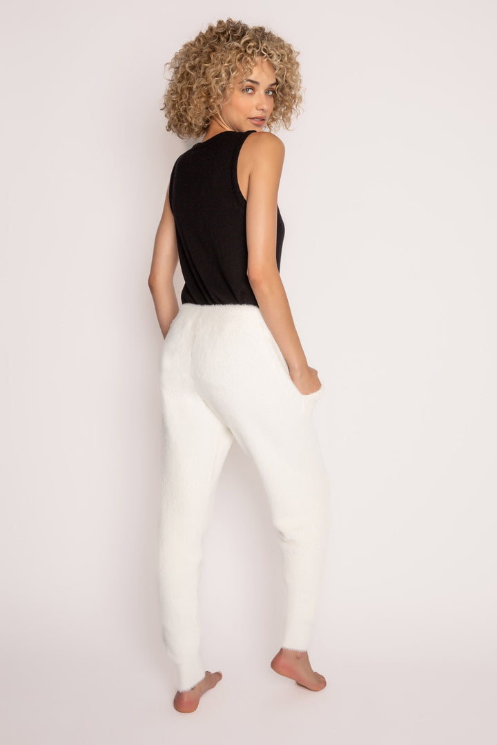 Soft ivory feather knit jogger sweater pant, with relaxed fit. Ribbed cuffs, tie waist & front pockets. (7257680216164)