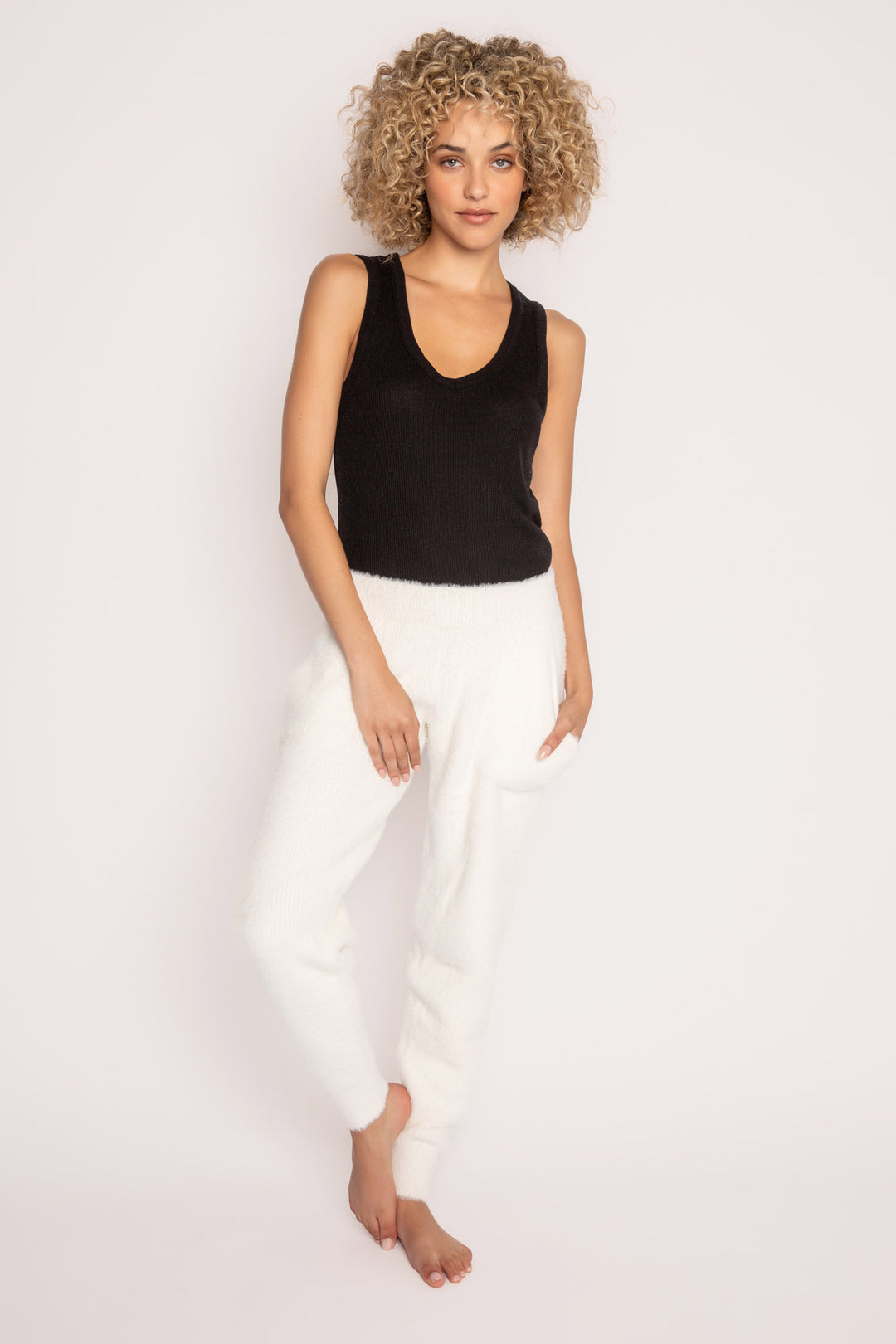 Soft ivory feather knit jogger sweater pant, with relaxed fit. Ribbed cuffs, tie waist & front pockets. (7257680216164)