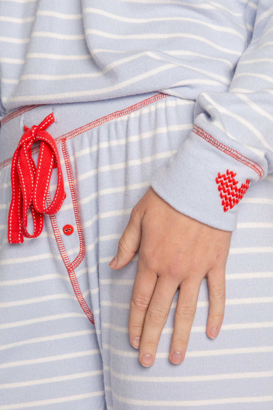 PJ set in blue-white striped knit, red stitching & heart embroidery at sleeve & pant cuffs. Red ties. (7257680314468)