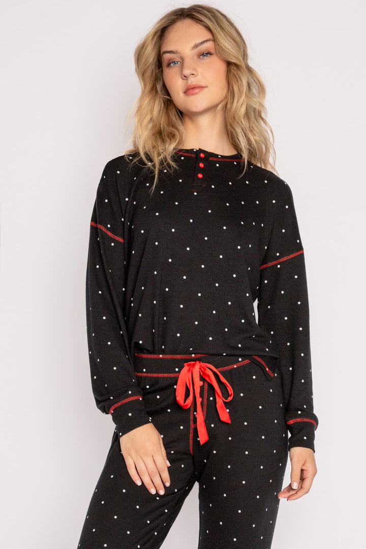 Black pajama set in matching gift bag. Dot-print top & pj pant & red /ribbon tie, in Repreve soft knit. (7200024297572)