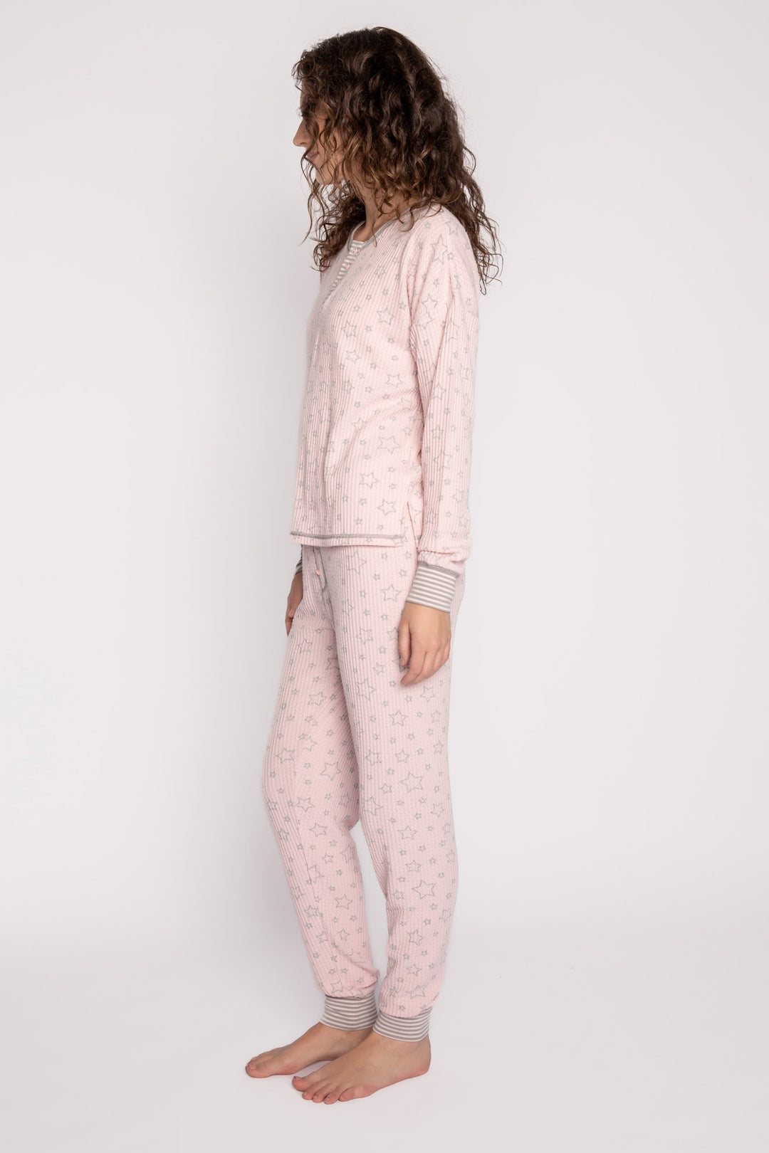Pink with grey star printed waffle pajama set. 3-button Henley top & jammie pant. Striped cuffs. (7257680773220)