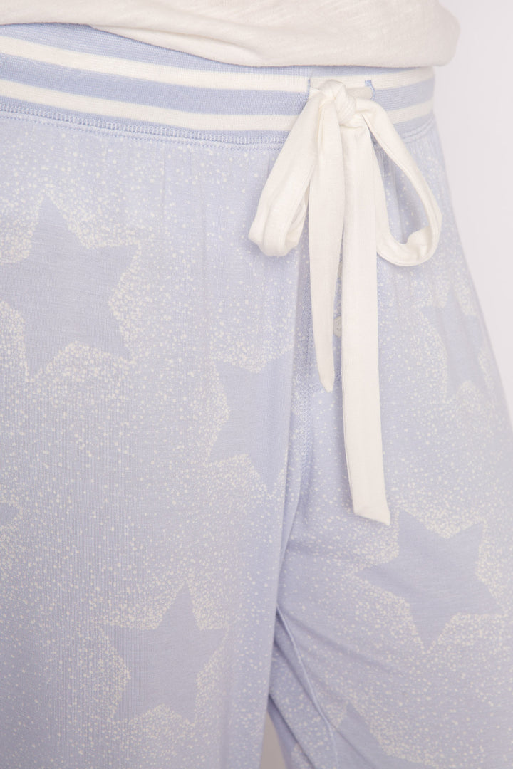 Luxe aloe-infused jersey pajama pant in light blue with muted ivory star print. White striped cuffs. (7257680904292)