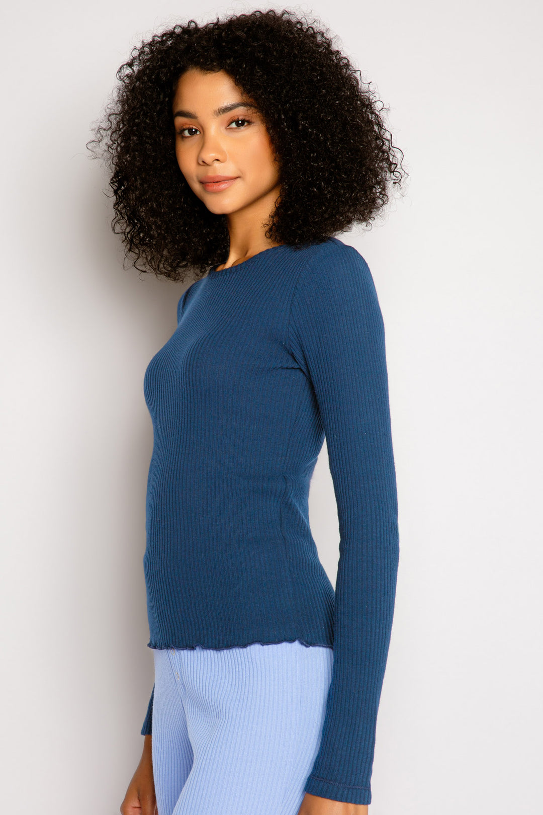 Navy fitted long sleeve rib top in Repreve x Reloved recycled soft knit with merrow stitched hem. (7325665394788)