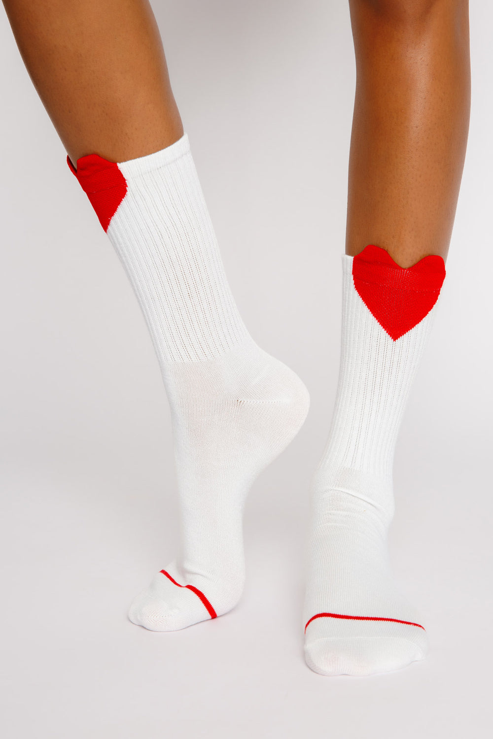 Ivory ribbed cozy socks with red applique heart at top of socks. Gripper print on soles for non-skid. (7325666148452)