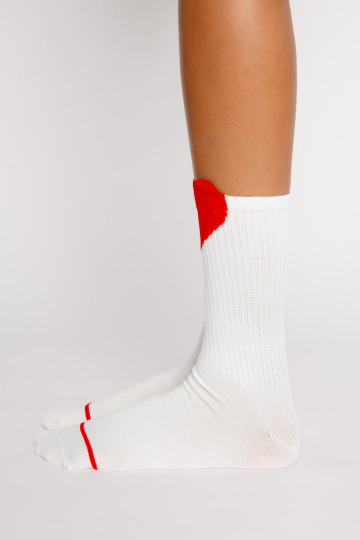 Ivory ribbed cozy socks with red applique heart at top of socks. Gripper print on soles for non-skid. (7325666148452)