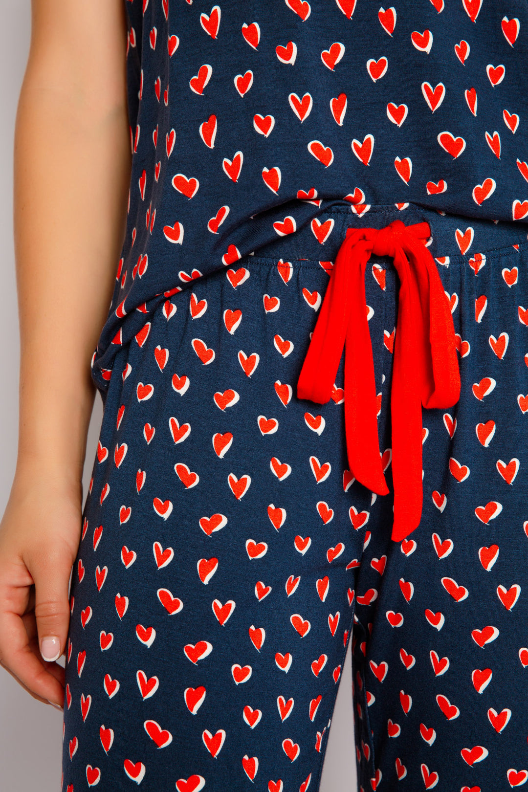 Navy blue heart-printed sleep set camisole & pj pant in modal with aloe-cooling finish. Red contrast ties. (7325667164260)