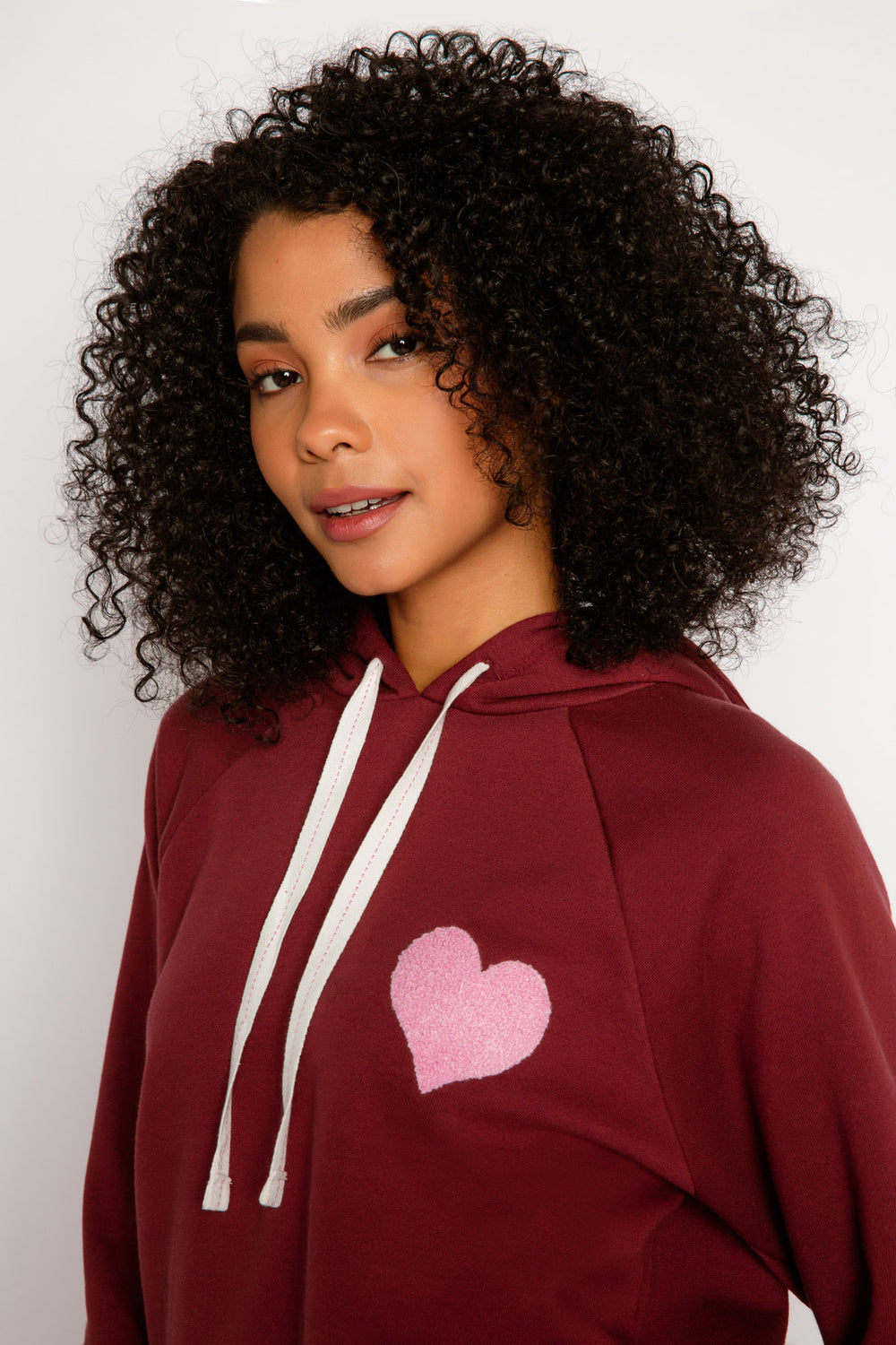 Burgundy fleece pullover hoodie wiht ties. Relaxed fit wiht pink applique on chest. (7325668343908)