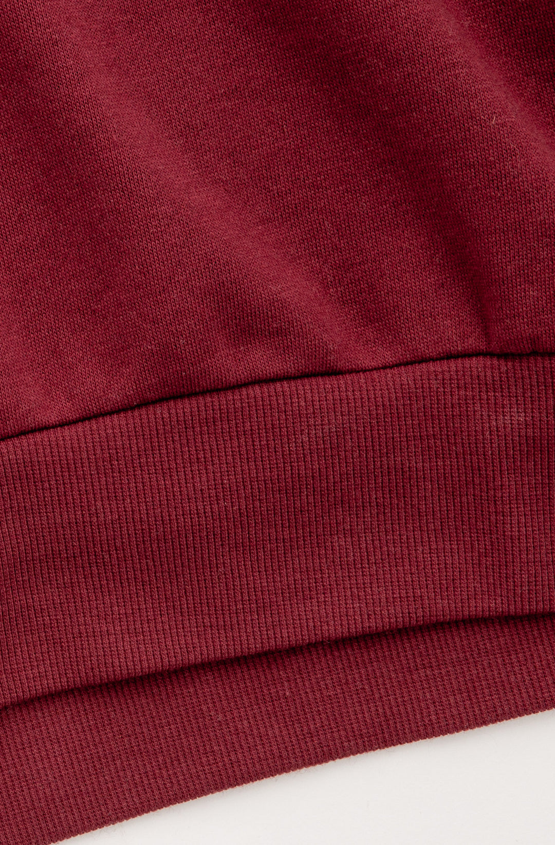 Burgundy fleece jogger pant. Tie waist wiht pink applique on hip. (7325668540516)