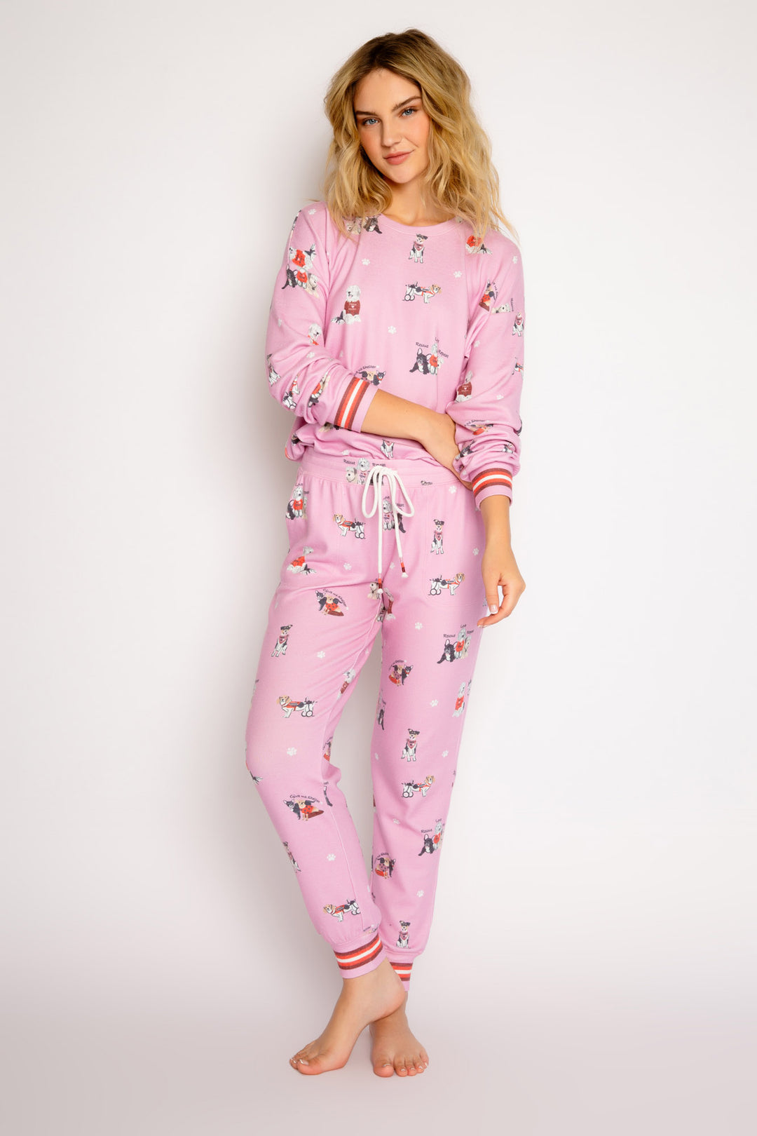 Pink pajama set in peachy knit with rescue-dog theme print. Long sleeve top & jammie pant. (7325668638820)