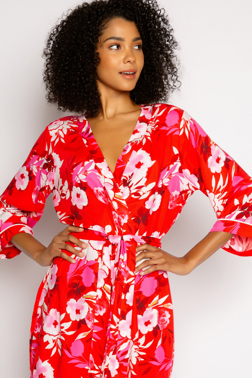 Robe in red-pink floral-printed woven sateen. Self tie belt & 3/4 kimono sleeve. (7325669490788)