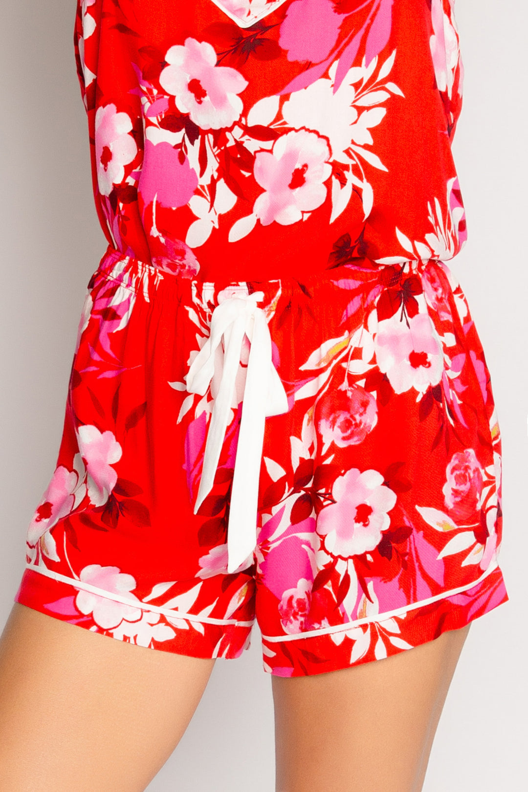 Sleep short in red-pink floral-printed woven sateen. Ivory ribbon tie waist & piping. (7325669621860)
