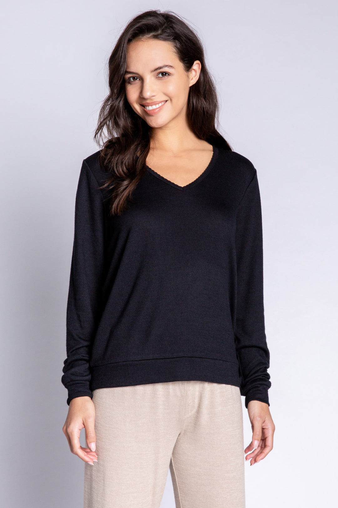 Black V-neck top in recycled REPREVE® jersey. Picot trim at neck, with a clean fit & banded cuffs. (6612549533796)
