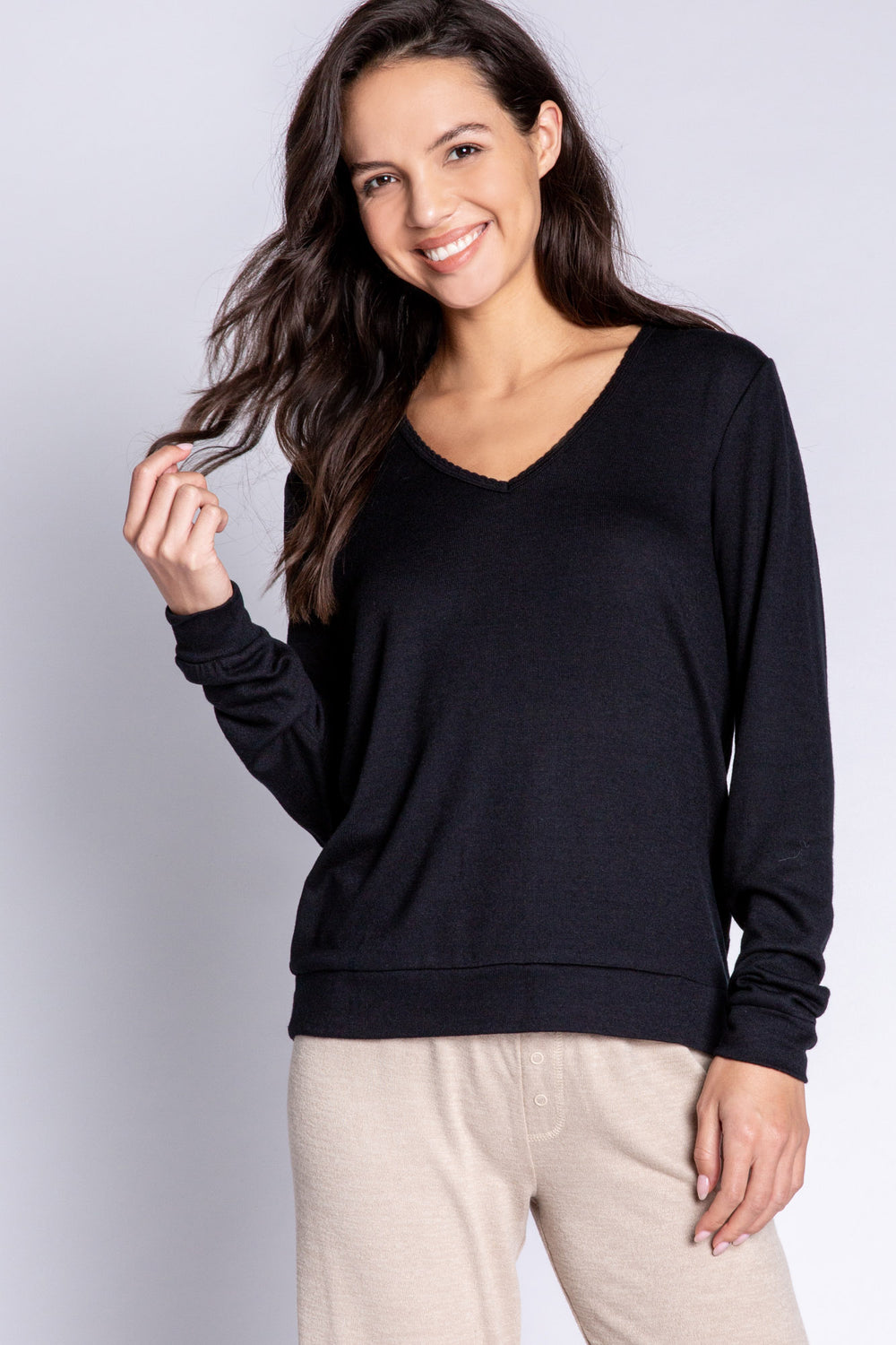 Black V-neck top in recycled REPREVE® jersey. Picot trim at neck, with a clean fit & banded cuffs. (6612549533796)