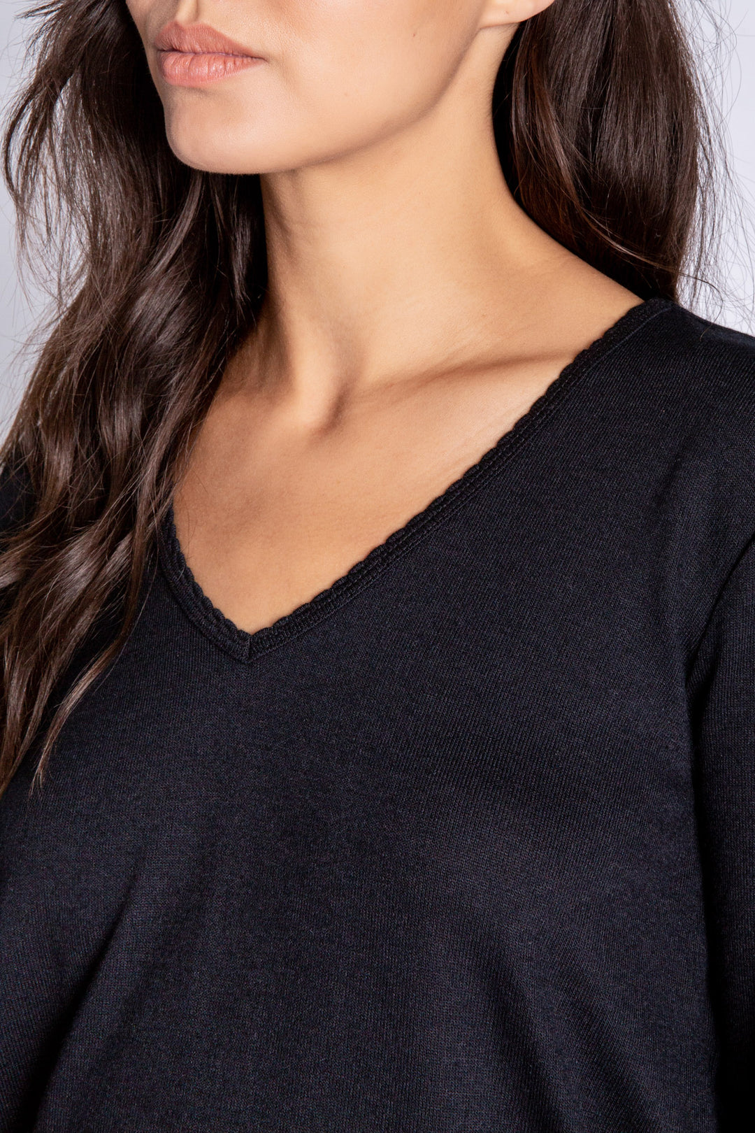 Black V-neck top in recycled REPREVE® jersey. Picot trim at neck, with a clean fit & banded cuffs. (6612549533796)