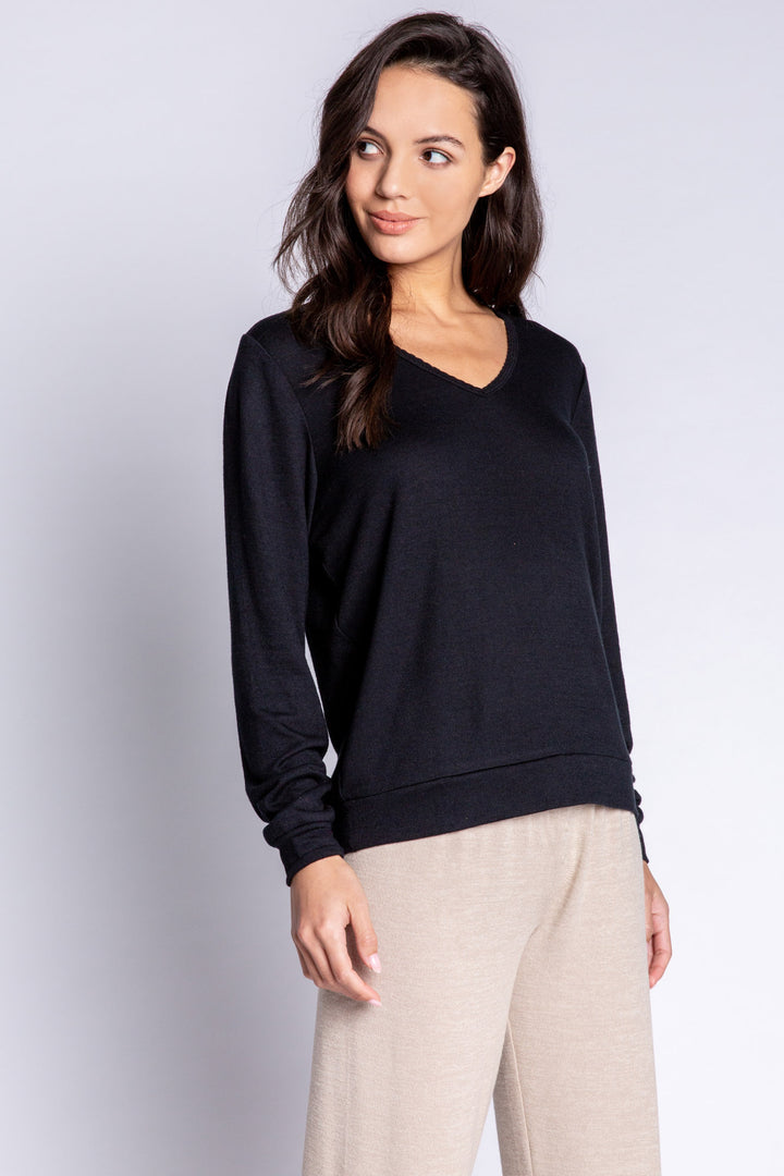 Black V-neck top in recycled REPREVE® jersey. Picot trim at neck, with a clean fit & banded cuffs. (6612549533796)