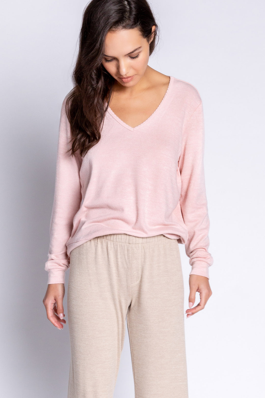 Light pink V-neck top in recycled REPREVE® jersey. Picot trim at neck, with a clean fit & banded cuffs. (6612549566564)
