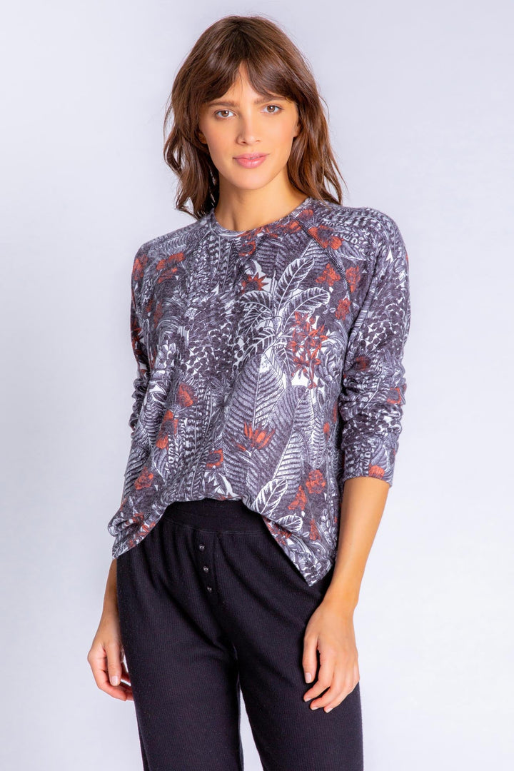 Peachy lounge top in exotic floral-feather print. Relaxed fit pullover with banded cuffs. (6839647567972)